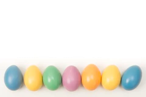 Different colored easter eggs on a white background Stock Photos
