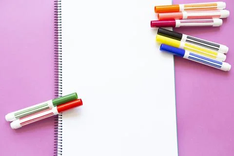 Different colored felt pens on blank page Stock Photos