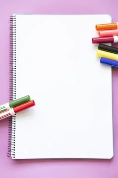 Different colored felt pens on blank page Stock Photos