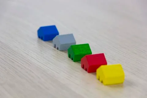 Different colored game pieces representing different houses, concept of choice 写真素材