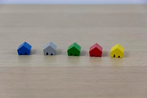Different colored game pieces representing different houses, concept of choice 写真素材