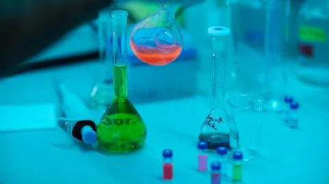 Different Colored Laboratory Flasks and Test Tubes Stock Photos