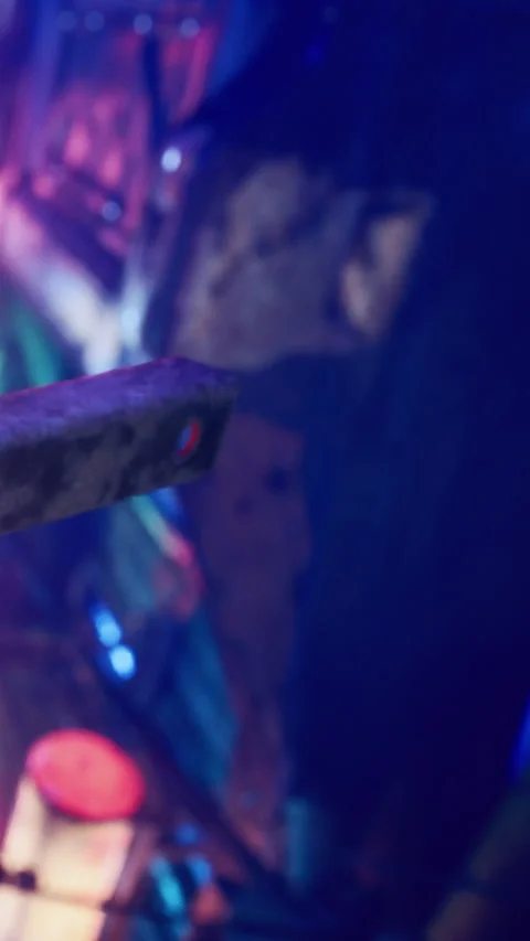 Different colored lights reflect on a rough surface in an indoor setting Stock Footage 335688364