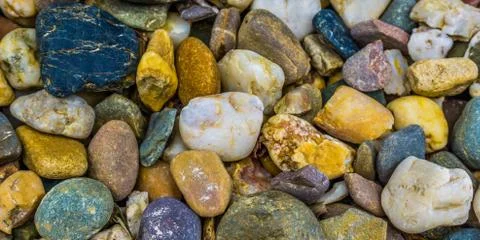 Different colored pebble stones macro close up background texture Stock Photos