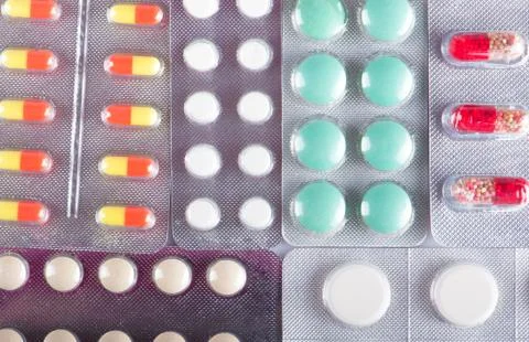 Different colored pills Stock Photos