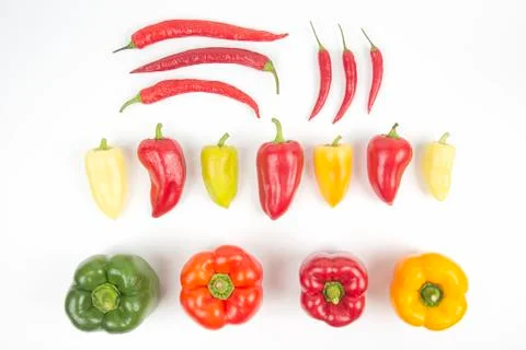 Different colored sweet and bitter peppers on a white background. vitamin foo Stock Photos