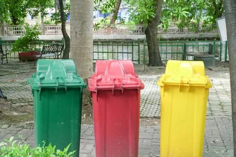 Different Colored Three Garbage Bins in public place, Environmental protectio Stock Photos