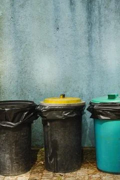 Different colored trash bins for separate waste in the street, recycling and  Stock Photos