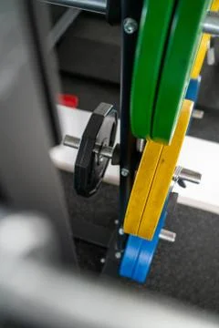 Different colored weight plates stacked Stock Photos