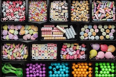 Different colorful beads on the table Stock Photos
