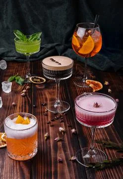 Different colorful exotic alcoholic cocktails on wood Stock Photos