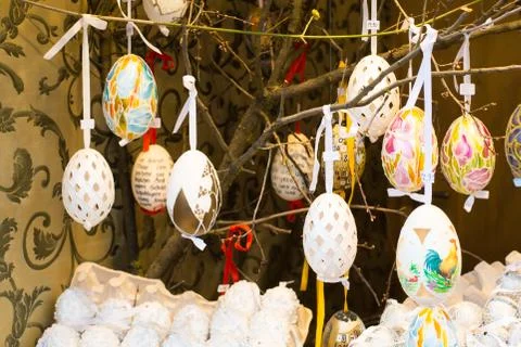 Different colorful painted Easter eggs on the tree at traditional European ma Stock Photos