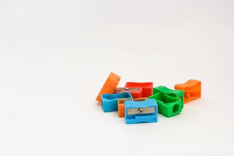 Different colors sharpener on white background with copy space. Stock Photos