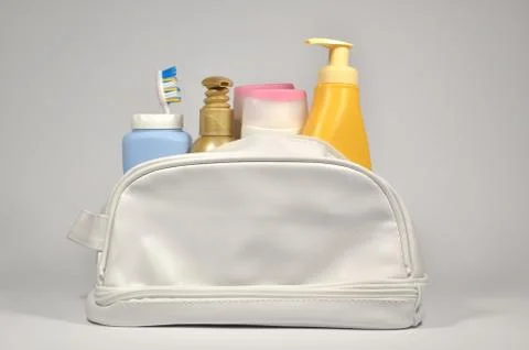 Different containers in cosmetic bag Stock Photos