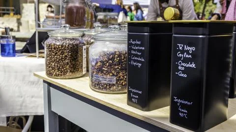 Different containers full of coffee and herbal tea mix at a street market Stock Photos