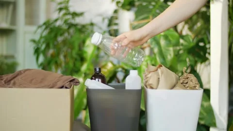 Different containers for sorting garbage at home. recycling plastic, paper Stock Footage 276421033