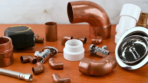 Different copper water pipe and fittings plumber tools. Stock Footage 153450750