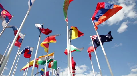 Different countries flags waving in blue sky Video stock 57227182