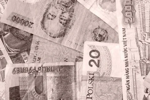 Different countries money background close up. Brown color toned Stock-Fotos