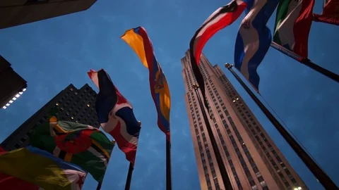Different country flags blown by the wind at Rockefeller Center in New York City Stock Footage 116744452