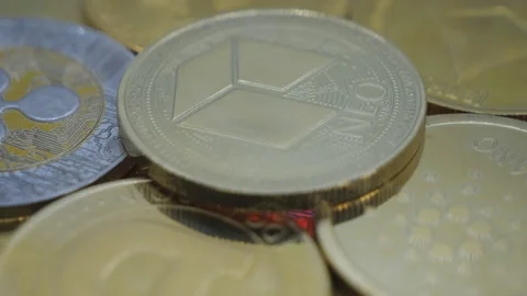 Different crypto coins with the Neo coin on top. Stock Footage 236729596