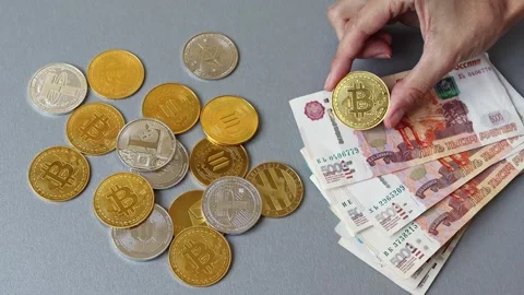 Different cryptocurrency coins and Russian rubles banknotes at the background Stock Footage 281513002