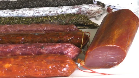 Different Cured Sausages On Table Stock-Footage 100544368