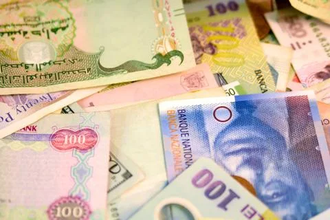 Different currency note and coins from different countries background Stock Photos