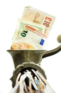 Different currency notes in a meat grinder Stock Photos