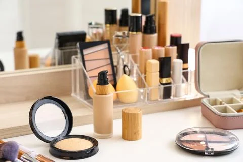 Different decorative cosmetics on table in room, closeup Stock Photos