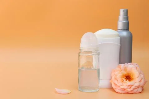 Different deodorants on beige background 스톡 사진