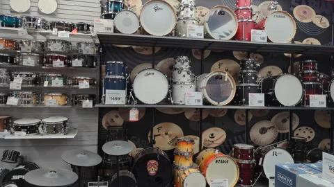 Different drums in music instruments store. Drum sets in displayed in music.. 스톡 동영상 333590929