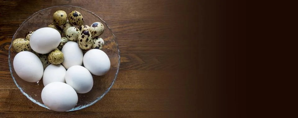 Different eggs background. Quail eggs on white dish, There are many sizes and Stock Photos