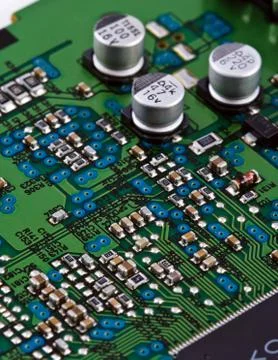 Different electonic elements on circuit board Stock Photos