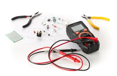 Different electronic parts or components, measurement tool and pliers on whit Stock Photos