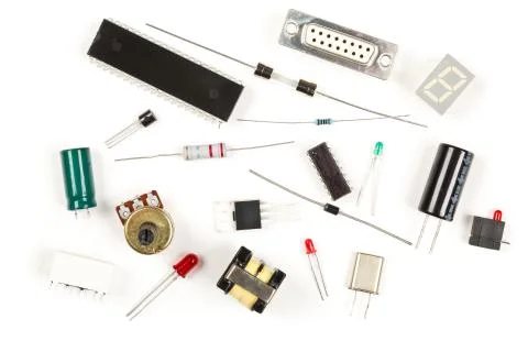 Different electronic parts or components on white with resistors, capacitors, Stock Photos