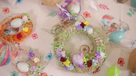 Different elements of decor on Easter. Wreath with decorative eggs Stock Footage 151385335