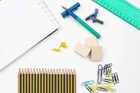 Different elements or essential school supplies such as pencils, erasers and Stock Photos