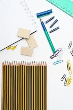 Different elements or essential school supplies such as pencils, erasers and Stock Photos