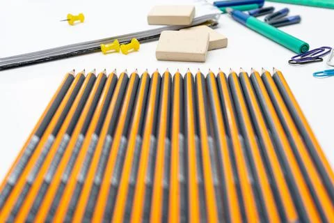 Different elements or essential school supplies such as pencils, erasers and Stock Photos
