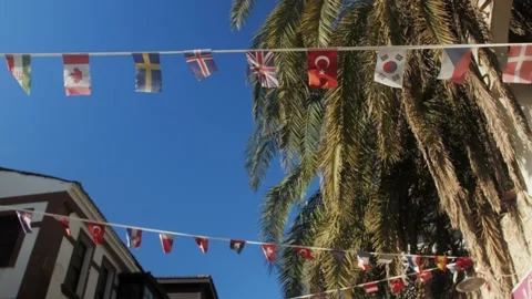 Different flags of all nations in the world in the street on hotel entrance. Stock Footage 221878590