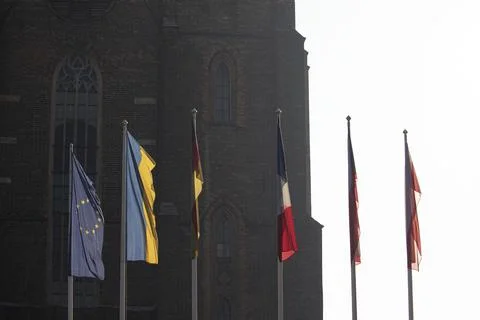 Different flags floating in the air. Stock Photos