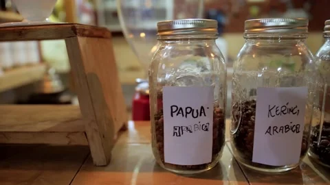 Different flavours of coffee in jars in shop shelves Stock Footage 131522325