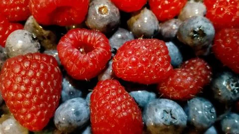Different fresh berries as background. raspberry and blueberry Stock Photos