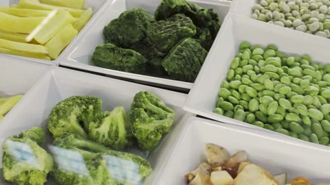 Different frozen vegetables as background in store supermarket, top view Video stock 222013739