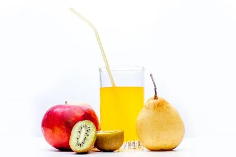 Different fruit and juice or smoothie in a glass Stock Photos