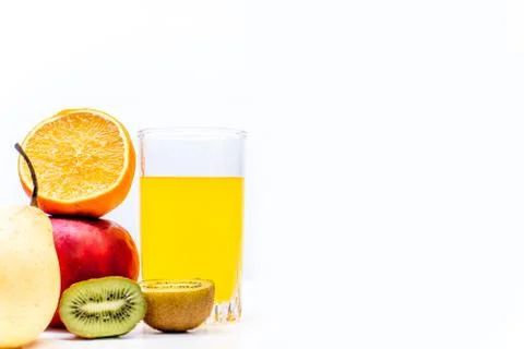 Different fruit and juice or smoothie in a glass Stock Photos