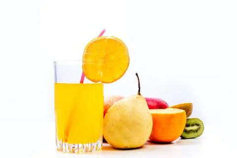 Different fruit and juice or smoothie in a glass Stock Photos