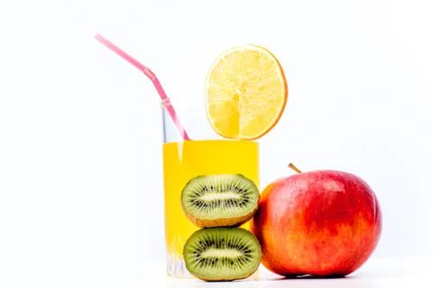Different fruit and juice or smoothie in a glass Stock Photos