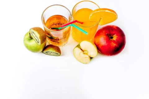 Different fruit and juice or smoothie in a glass Stock Photos